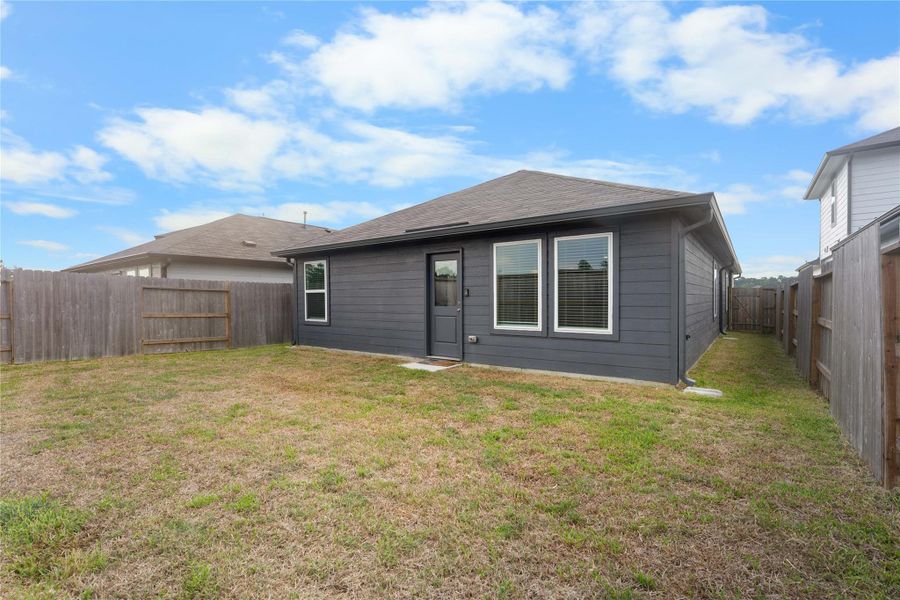 Convenient gated side access makes getting to the backyard easy.