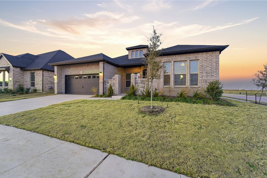 Front exterior of a new home in Green Meadows, Celina, TX, highlighting curb appeal (Image 2). Front exterior of a new home in Green Meadows, Celina, TX, highlighting curb appeal (Image 2).