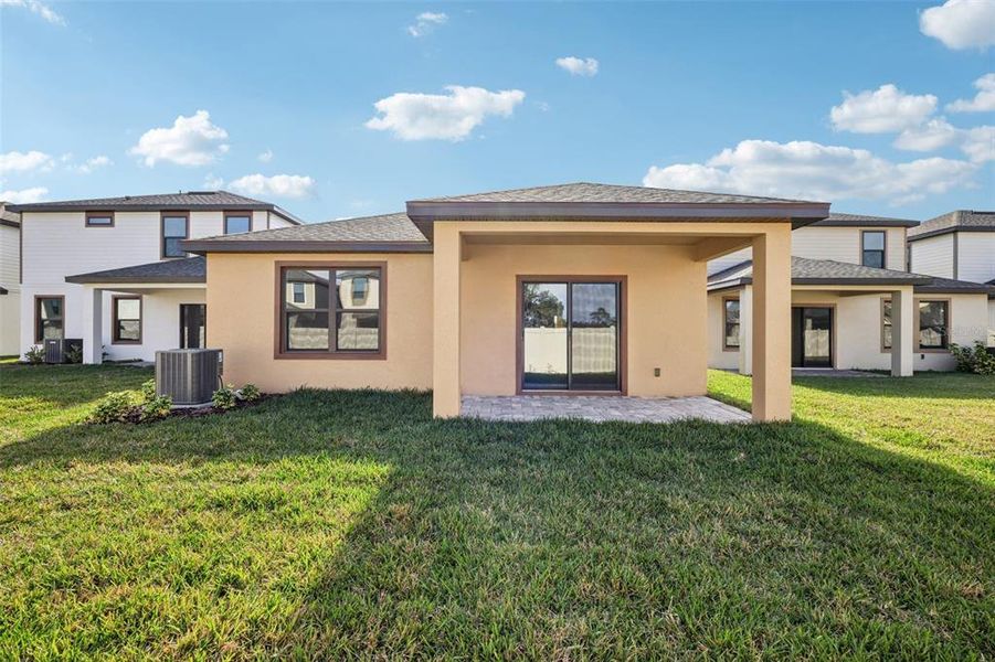 Exterior details and patio area of a home in Grasslands West, Lakeland (Image 3).