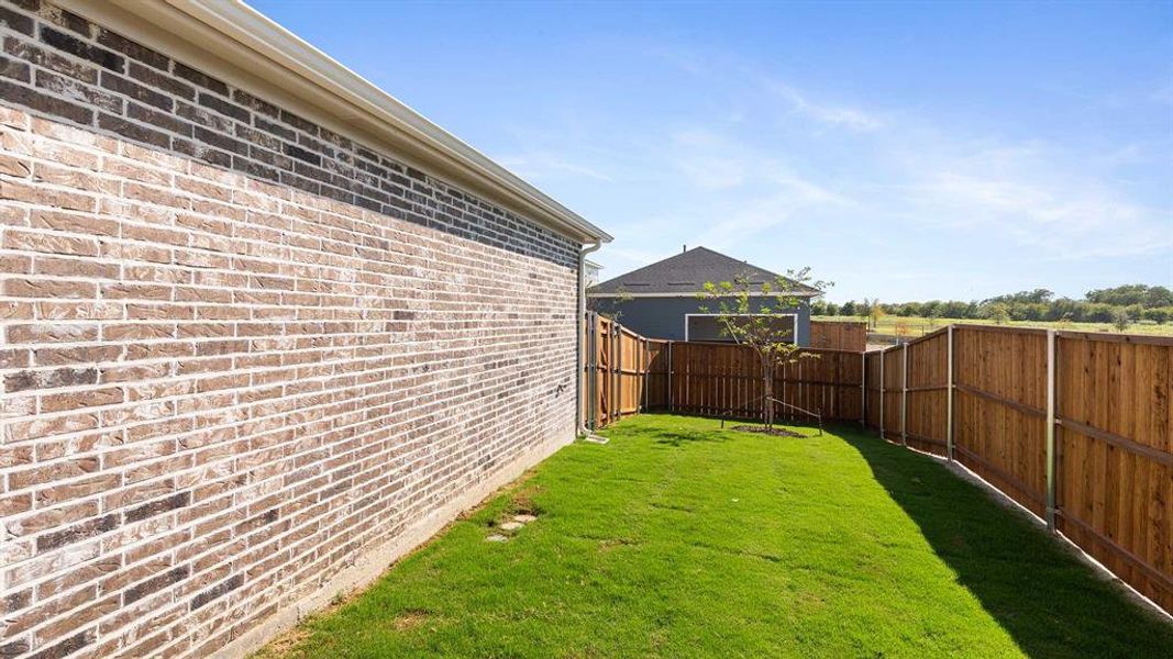 Exterior details and patio area of a home in The Heights At Uptown Celina 45', Celina (Image 3). Exterior details and patio area of a home in The Heights At Uptown Celina 45', Celina (Image 3).