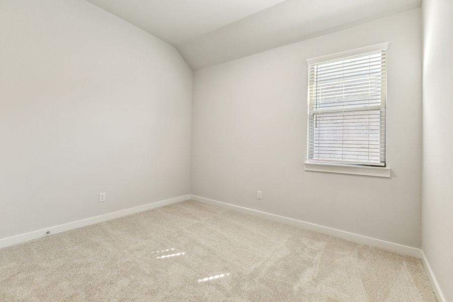 Bedroom in the Cedar home plan by Trophy Signature Homes – REPRESENTATIVE PHOTO