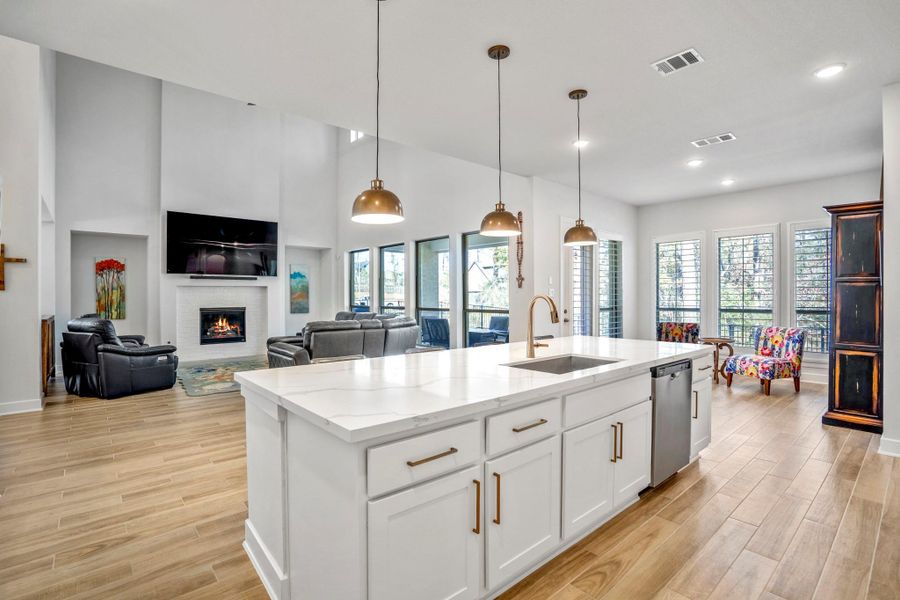 This spacious, open-concept layout is well-lit with natural light that seamlessly connects the heart of the home as one.
