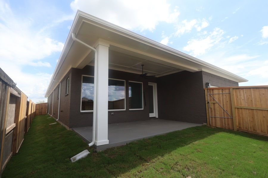 Exterior details and patio area of a home in Riceland - Enclave Row Collection, Mont Belvieu (Image 3).