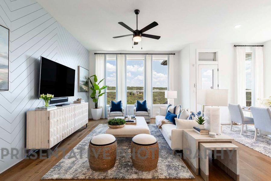 Living room with ceiling fan and wood finished floors