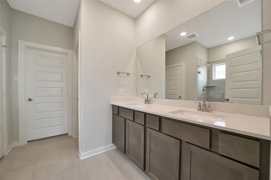 Furnished interior view inside a new home in Sunterra, Katy (Image 37).