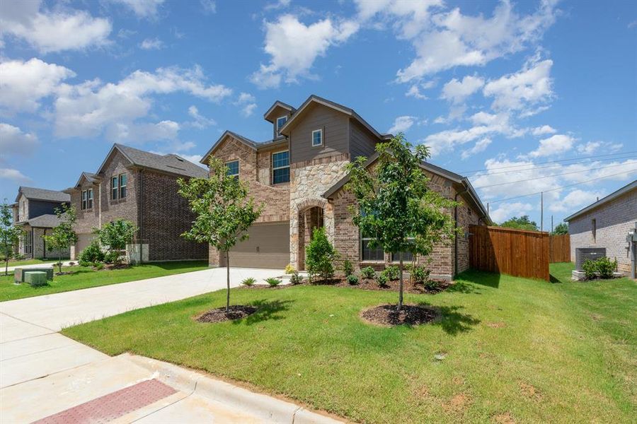 Front exterior of a new home in Courts Of Bonnie Brae, Denton, TX, highlighting curb appeal (Image 19).
