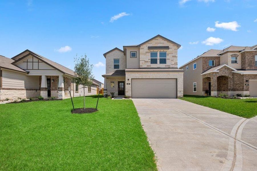 A perfect blend of modern elegance and traditional charm, this home showcases timeless brick and stone accents, a 6 Lite Mahogany door, and a fully sodded yard. The spacious driveway and attached two-car garage complete the welcoming curb appeal.