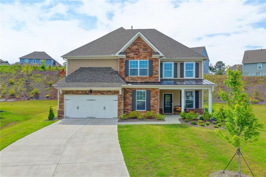 Front exterior of a new home in , Cumming, GA, highlighting curb appeal (Image 1). Front exterior of a new home in , Cumming, GA, highlighting curb appeal (Image 1).