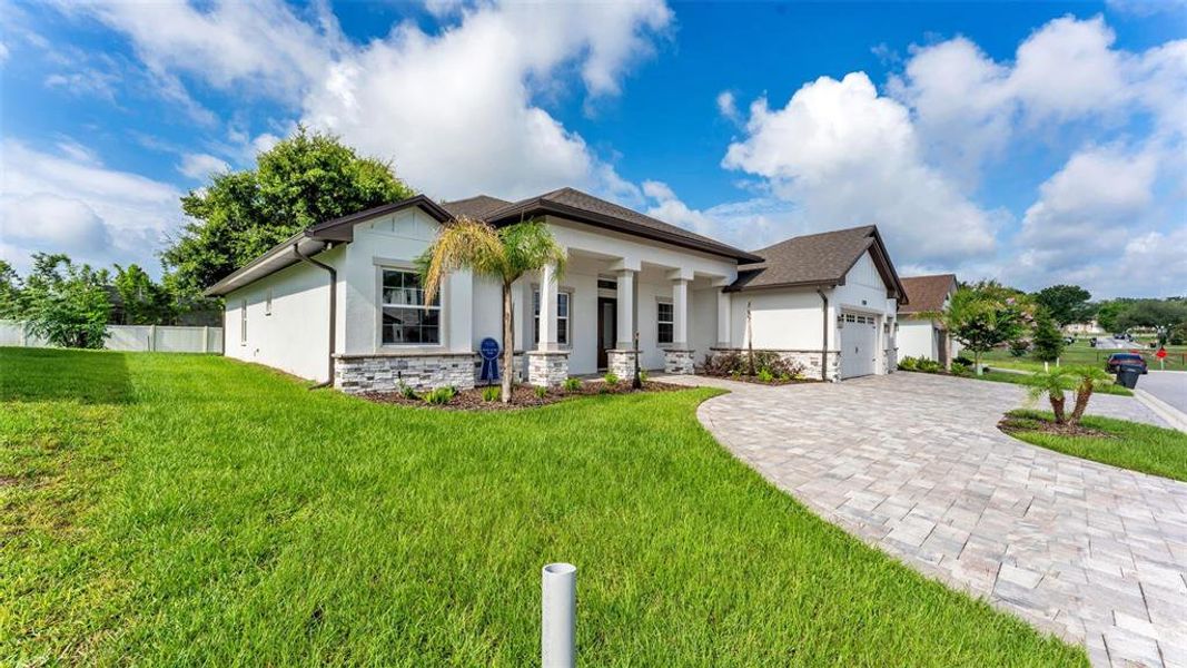 Front exterior of a new home in , Lakeland, FL, highlighting curb appeal (Image 25).