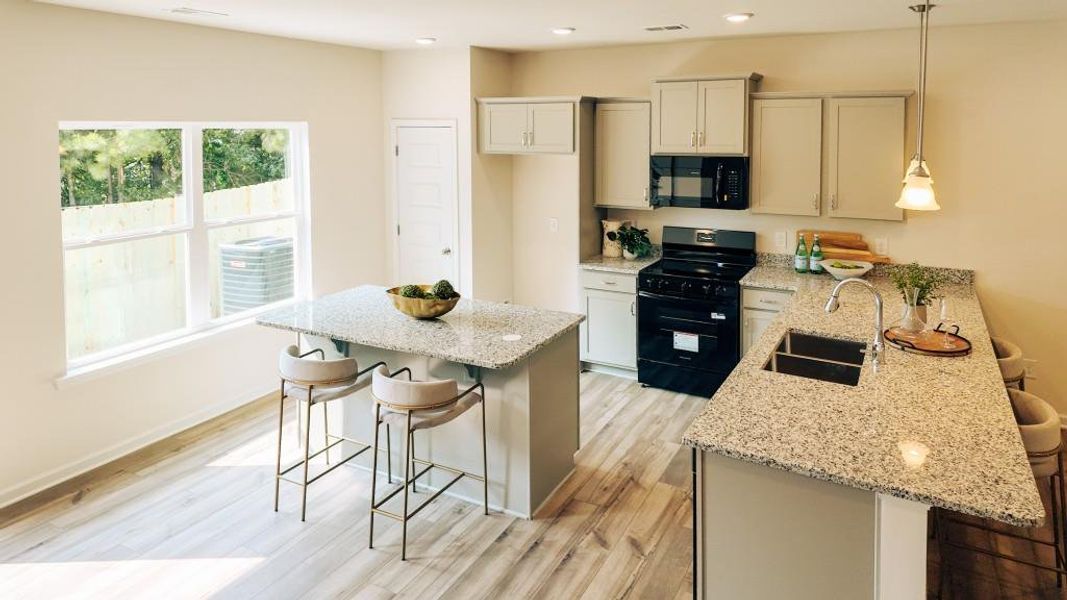 Furnished interior view inside a new home in Sterling At The Villages, Calhoun (Image 10).