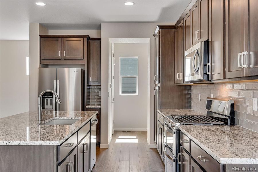 Furnished interior view inside a new home in Crescendo Collection at Reunion, Commerce City (Image 8). Furnished interior view inside a new home in Crescendo Collection at Reunion, Commerce City (Image 8).