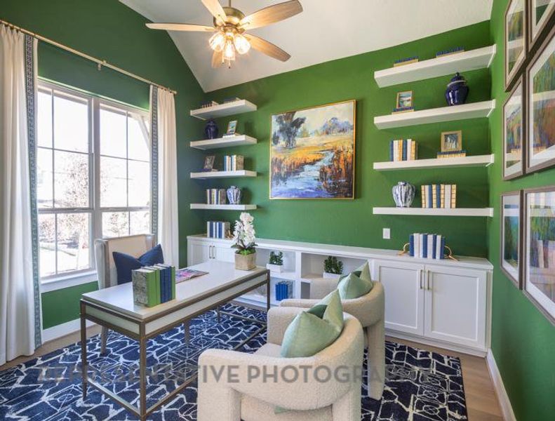 Office space featuring lofted ceiling, baseboards, a ceiling fan, and wood finished floors Office space featuring lofted ceiling, baseboards, a ceiling fan, and wood finished floors