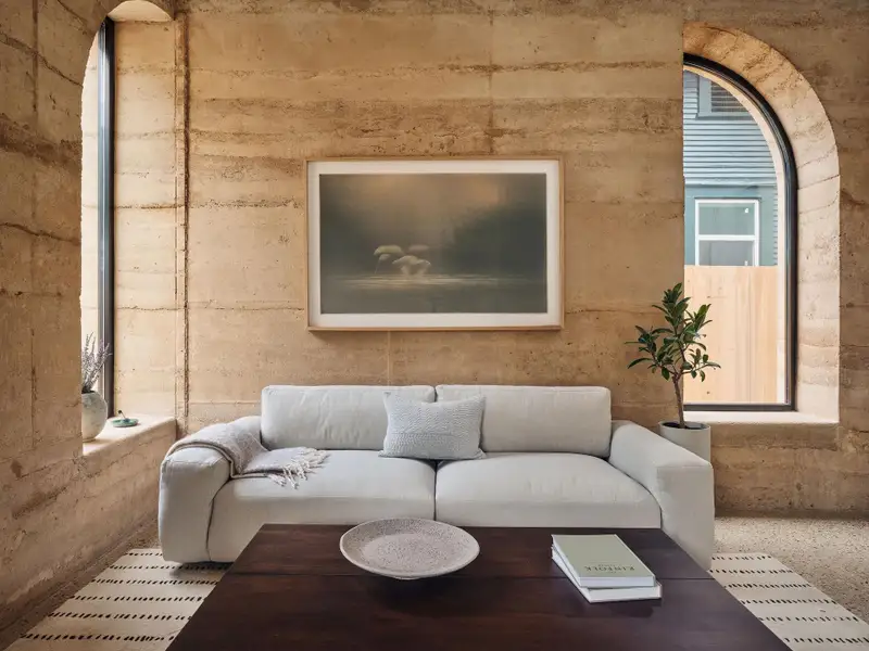 Rammed earth construction is an ancient technique, blendingtimeless craftsmanship with sustainable innovation. A mixture ofsoil, gravel, cement and water is poured into 24-inch-thick formsand tamped down to half its original height, layer by layer. Theresult is a richly textured wall system—a natural tapestry of earthtones and striations—unique to each installation. Rammed earth construction is an ancient technique, blendingtimeless craftsmanship with sustainable innovation. A mixture ofsoil, gravel, cement and water is poured into 24-inch-thick formsand tamped down to half its original height, layer by layer. Theresult is a richly textured wall system—a natural tapestry of earthtones and striations—unique to each installation.