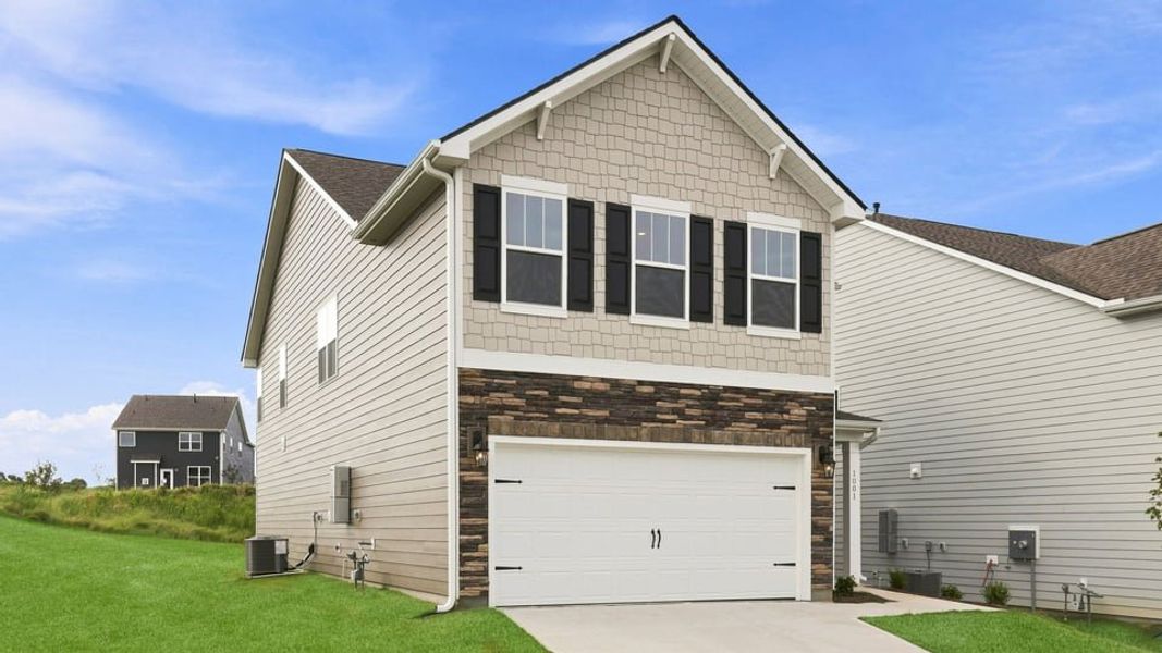 Front exterior of a new home in Adams Glen, Greenville, SC, highlighting curb appeal (Image 2). Front exterior of a new home in Adams Glen, Greenville, SC, highlighting curb appeal (Image 2).