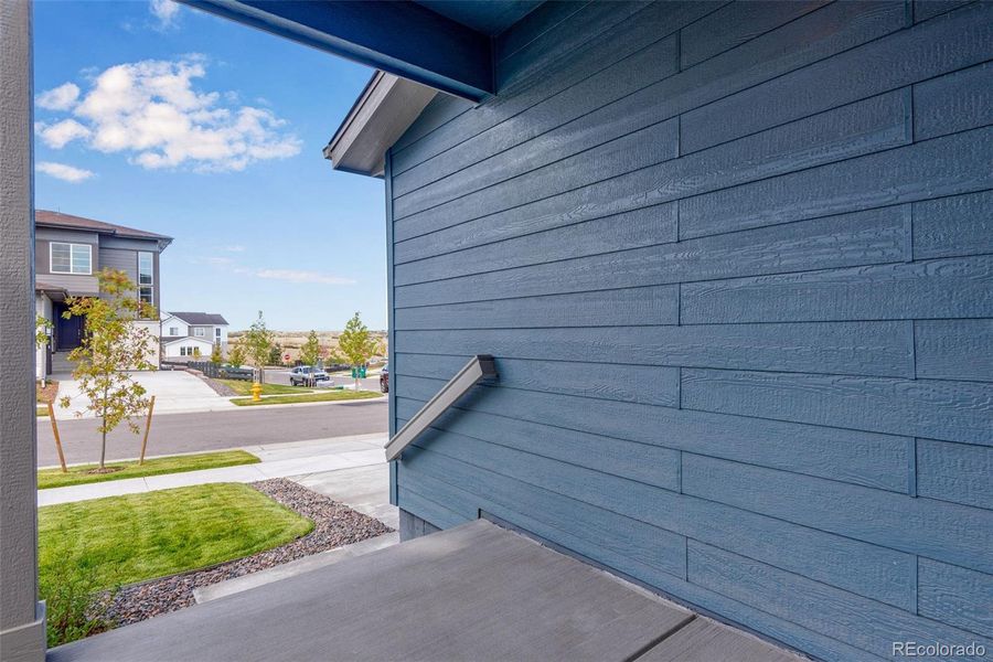 Front exterior of a new home in Wild Oak at The Canyons, Castle Pines, CO, highlighting curb appeal (Image 21). Front exterior of a new home in Wild Oak at The Canyons, Castle Pines, CO, highlighting curb appeal (Image 21).