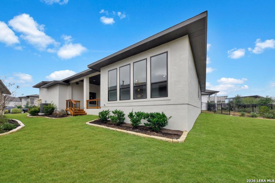 Exterior details and patio area of a home in El Sonido at Campanas, San Antonio (Image 25).