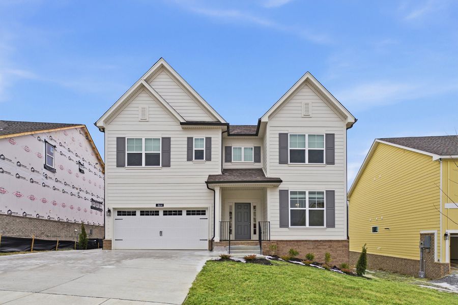 Front exterior of a new home in The Retreat at Norman Farm, Hendersonville, TN, highlighting curb appeal (Image 1). Front exterior of a new home in The Retreat at Norman Farm, Hendersonville, TN, highlighting curb appeal (Image 1).