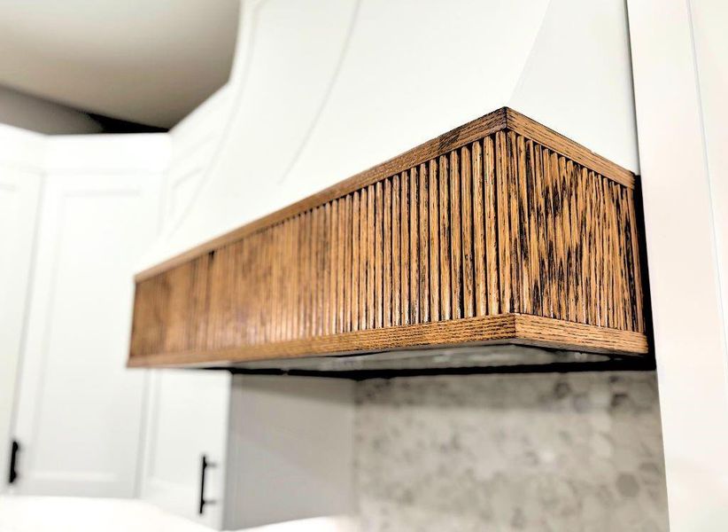 Kitchen view of custom range hood Kitchen view of custom range hood