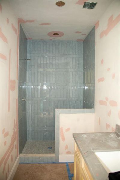 Secondary Bathroom Designer floor-to-ceiling tile with a modern aesthetic