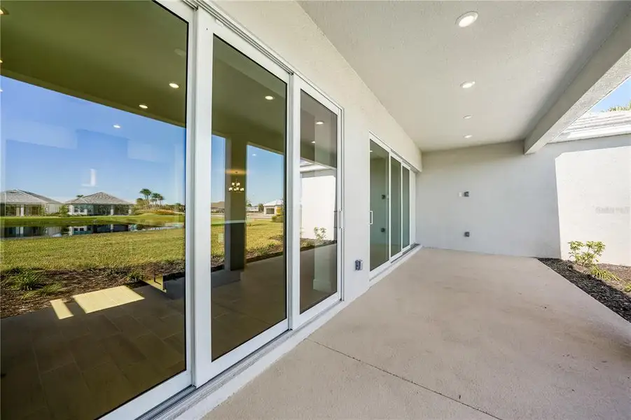 Exterior details and patio area of a home in Esplanade at Skye Ranch, Sarasota (Image 3).