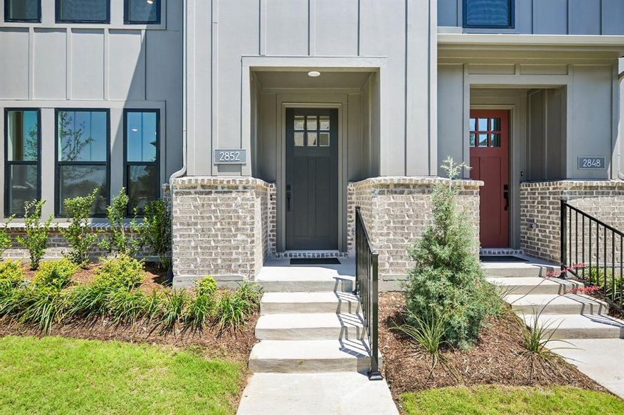 This beautiful and inviting modern Farm House entry creates outstanding curb appeal for your new dream home!