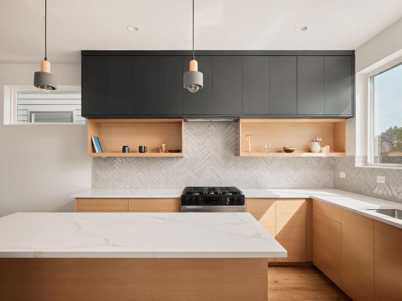Kitchen with open shelves, modern cabinets, tasteful backsplash, hanging light fixtures, and stainless steel range with gas cooktop