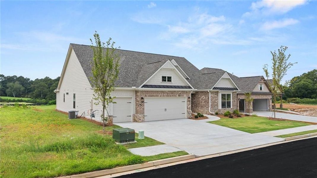 Front exterior of a new home in Soleil Summit Chase, Snellville, GA, highlighting curb appeal (Image 24).
