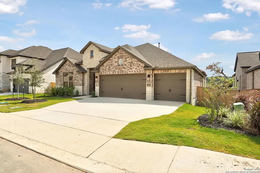 Front exterior of a new home in Kinder Ranch 70's, San Antonio, TX, highlighting curb appeal (Image 1).