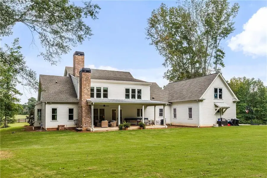 Front exterior of a new home in , Chattahoochee Hills, GA, highlighting curb appeal (Image 20).