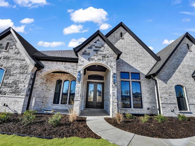 Front exterior of a new home in , Weatherford, TX, highlighting curb appeal (Image 25).