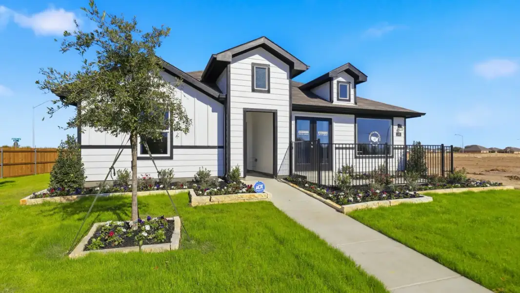 Representative exterior photo of a completed home built from the Justin by D.R. Horton in Hadley Farms, Godley, TX (Image 26).