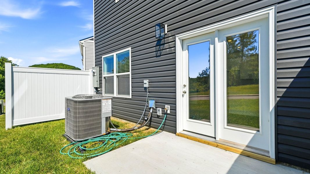 Exterior details and patio area of a home in The Arbor Townhomes, Kingsport (Image 3).