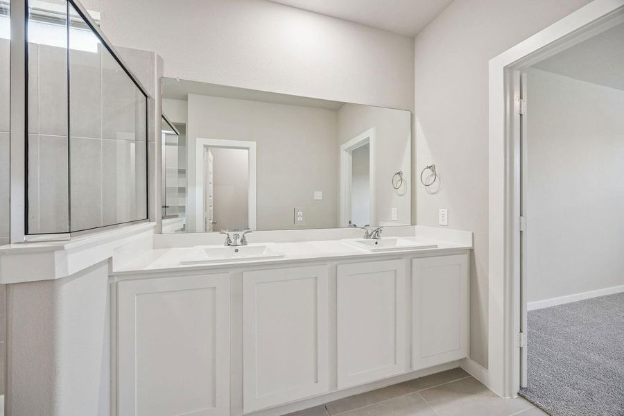 Primary Bathroom in the Willow home plan by Trophy Signature Homes – REPRESENTATIVE PHOTO Primary Bathroom in the Willow home plan by Trophy Signature Homes – REPRESENTATIVE PHOTO