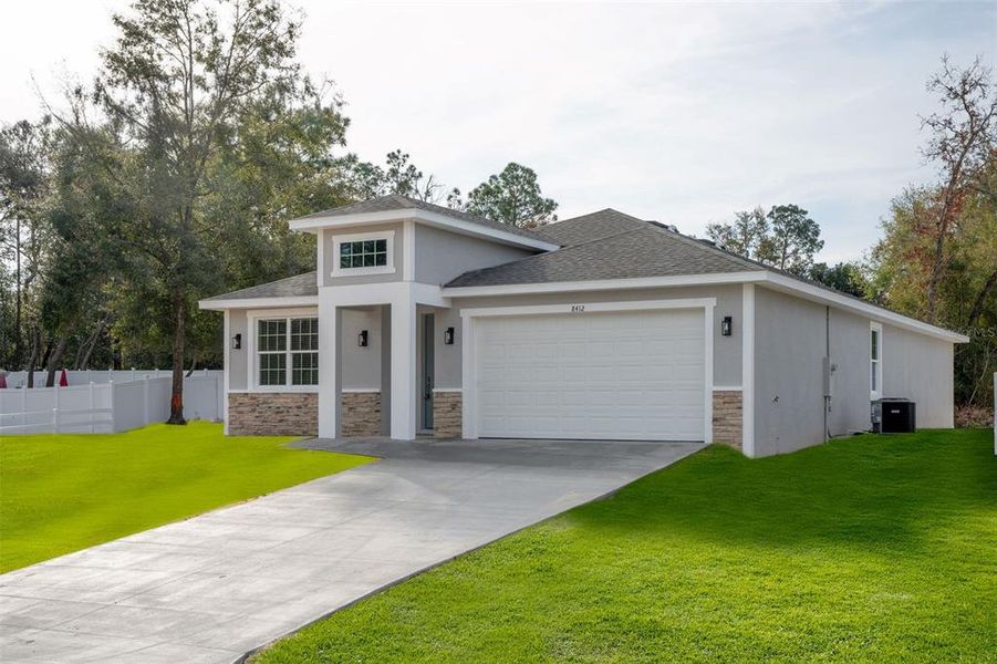 Front exterior of a new home in , Summerfield, FL, highlighting curb appeal (Image 17).