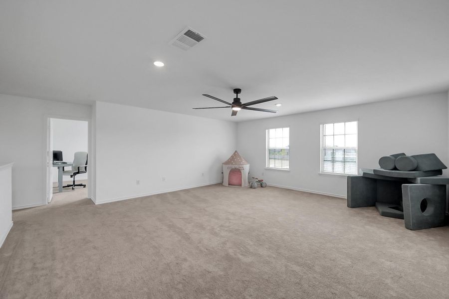 Upstairs, you will enjoy the large game room.