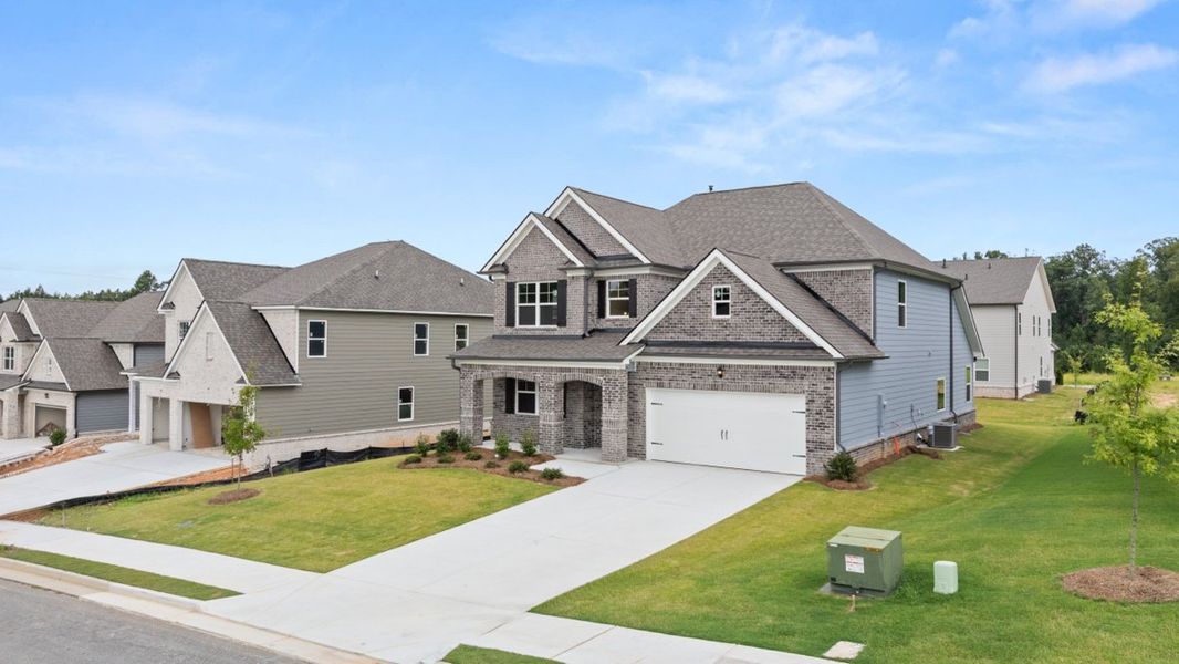Front exterior of a new home in Butner Estates, South Fulton, GA, highlighting curb appeal (Image 2).