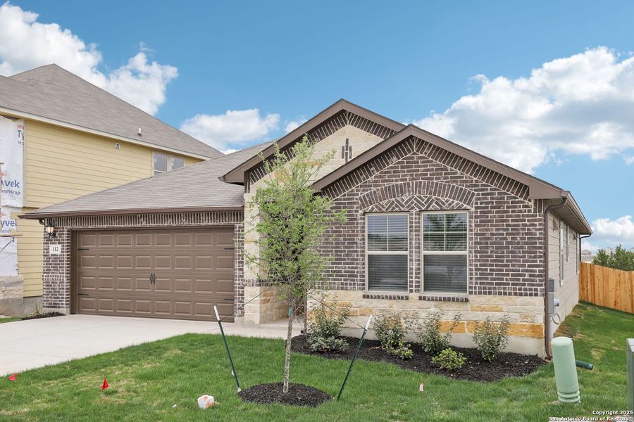 Front exterior of a new home in , Cibolo, TX, highlighting curb appeal (Image 26).