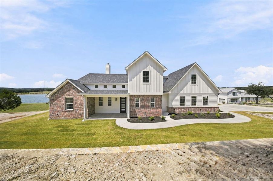 Front exterior of a new home in , Bluff Dale, TX, highlighting curb appeal (Image 23). Front exterior of a new home in , Bluff Dale, TX, highlighting curb appeal (Image 23).