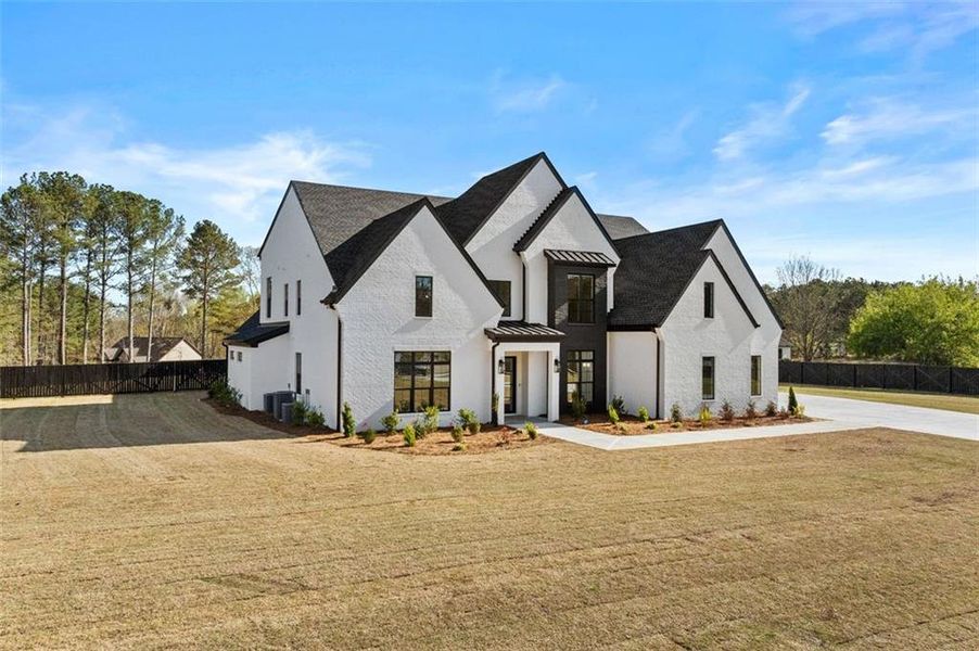 Front exterior of a new home in , Dacula, GA, highlighting curb appeal (Image 2).