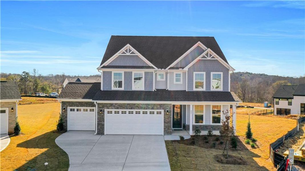 Front exterior of a new home in Twin Lakes, Hoschton, GA, highlighting curb appeal (Image 28).
