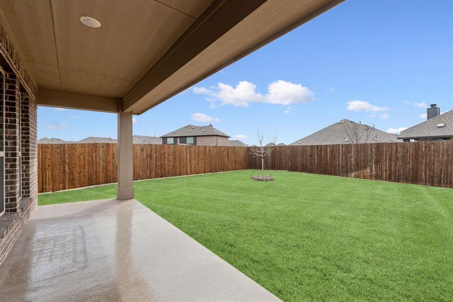 Back covered patio with epoxy flooring.