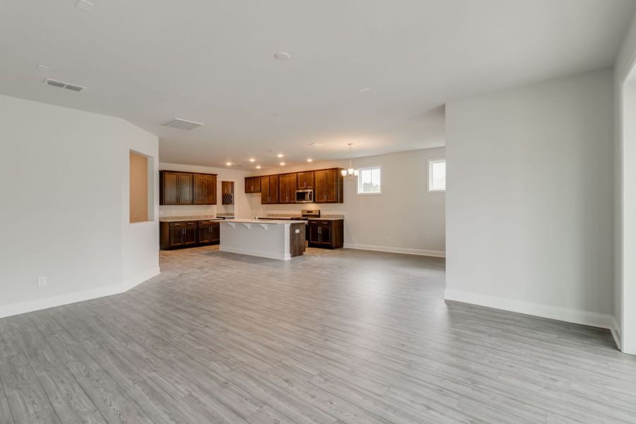 Open gathering room with large windows to bring in sunlight.