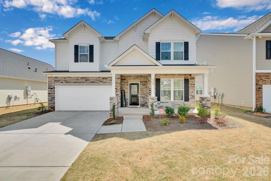 Front exterior of a new home in Clairmont, Charlotte, NC, highlighting curb appeal (Image 1). Front exterior of a new home in Clairmont, Charlotte, NC, highlighting curb appeal (Image 1).