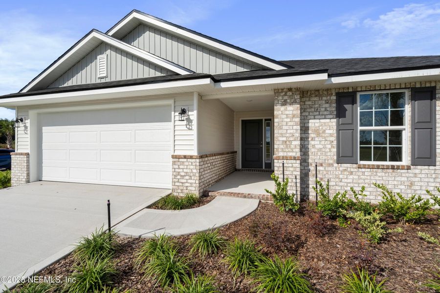 Front exterior of a new home in Shadow Crest at Rolling Hills, Green Cove Springs, FL, highlighting curb appeal (Image 2).