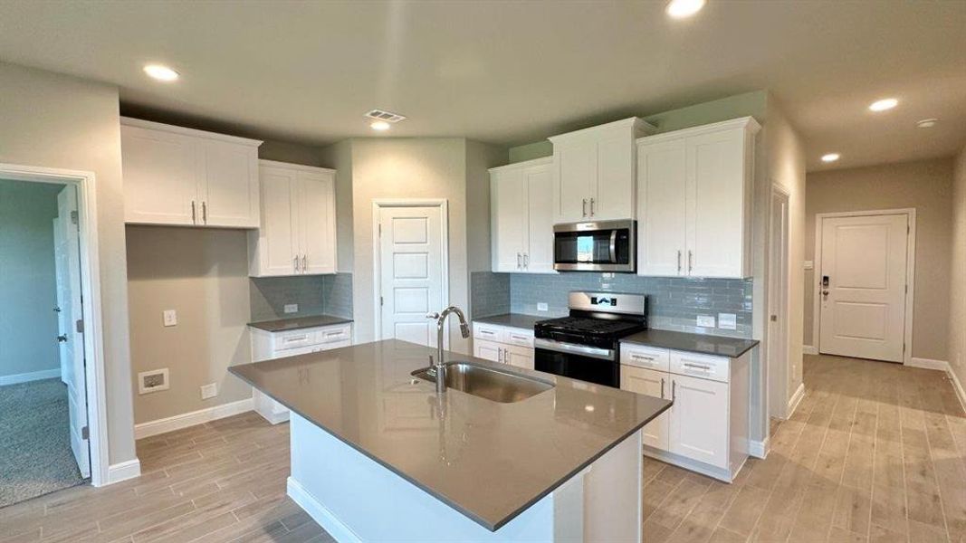 Kitchen - All Home and community information, including pricing, included features, terms, availability and amenities, are subject to change at any time without notice or obligation. All Drawings, pictures, photographs, video, square footages, floor plans, elevations, features, colors and sizes are approximate for illustration purposes only and will vary from the homes as built.