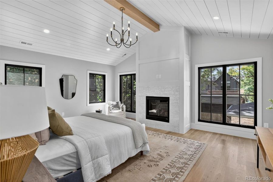Primary BedroomVaulted Ceilings/Fireplace/Wood Flors