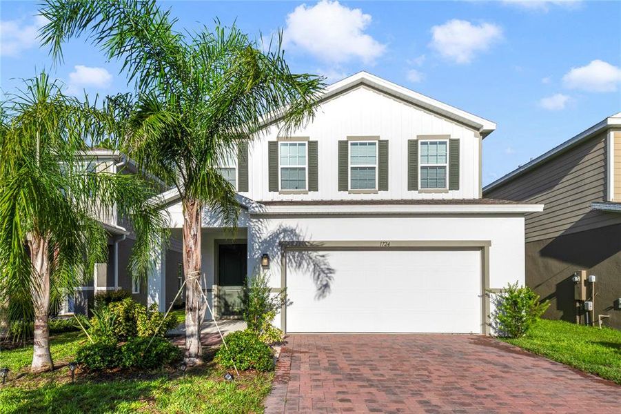 Front exterior of a new home in , Davenport, FL, highlighting curb appeal (Image 20).