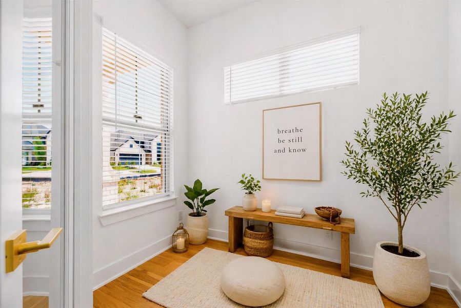 Private meditation room just off the home office—an ideal space for quiet focus, yoga, or a peaceful retreat, complete with natural light and warm wood flooring.