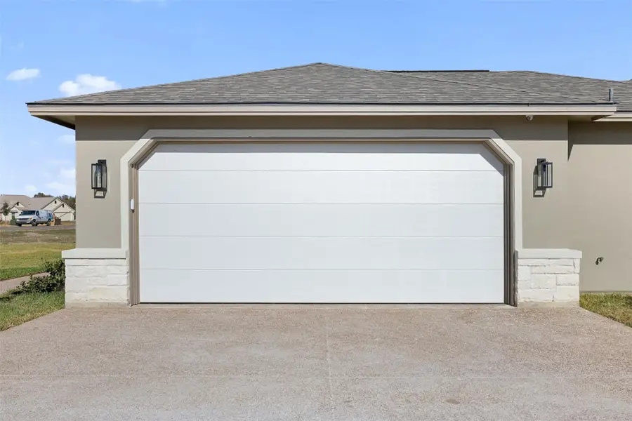Garage featuring driveway