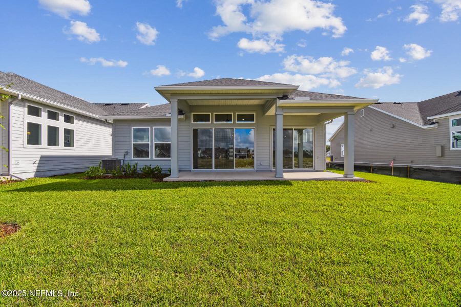 Exterior details and patio area of a home in Seven Pines 50' Front Entry, Jacksonville (Image 1).